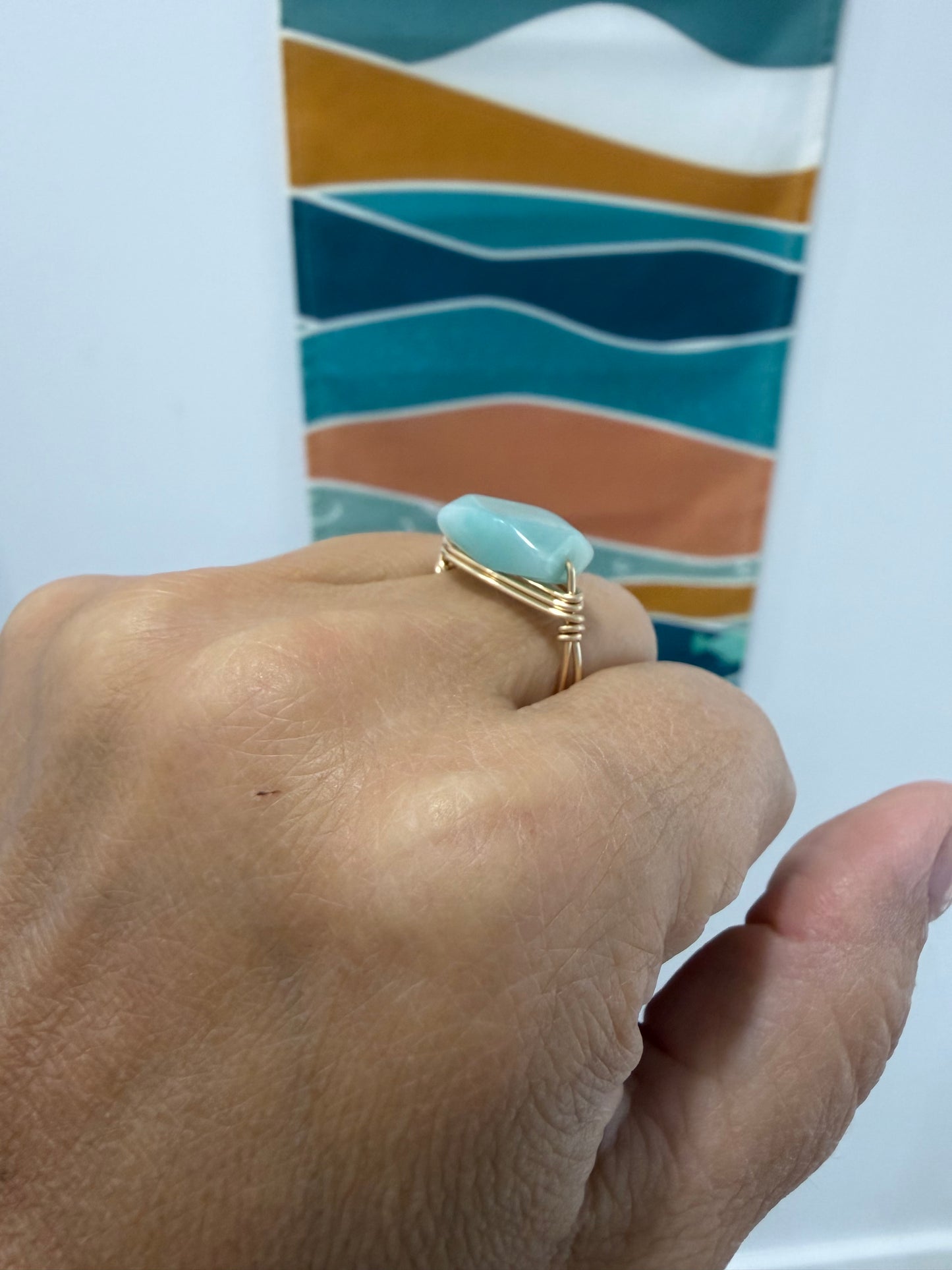Side view of handcrafted amazonite ring wrapped in 14k gold-filled wire
