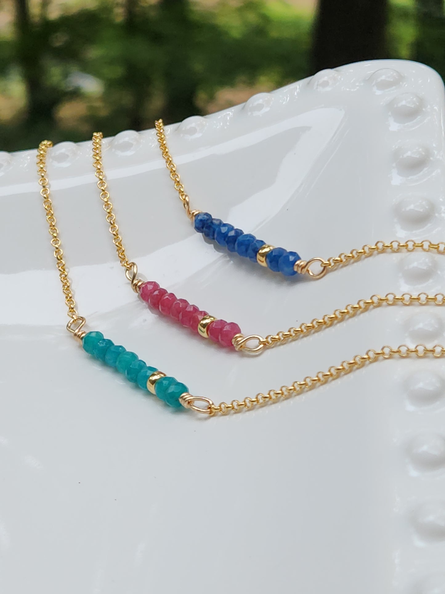 14k gold-filled beaded gemstone necklace featuring sapphire, pink ruby, and blue apatite stones