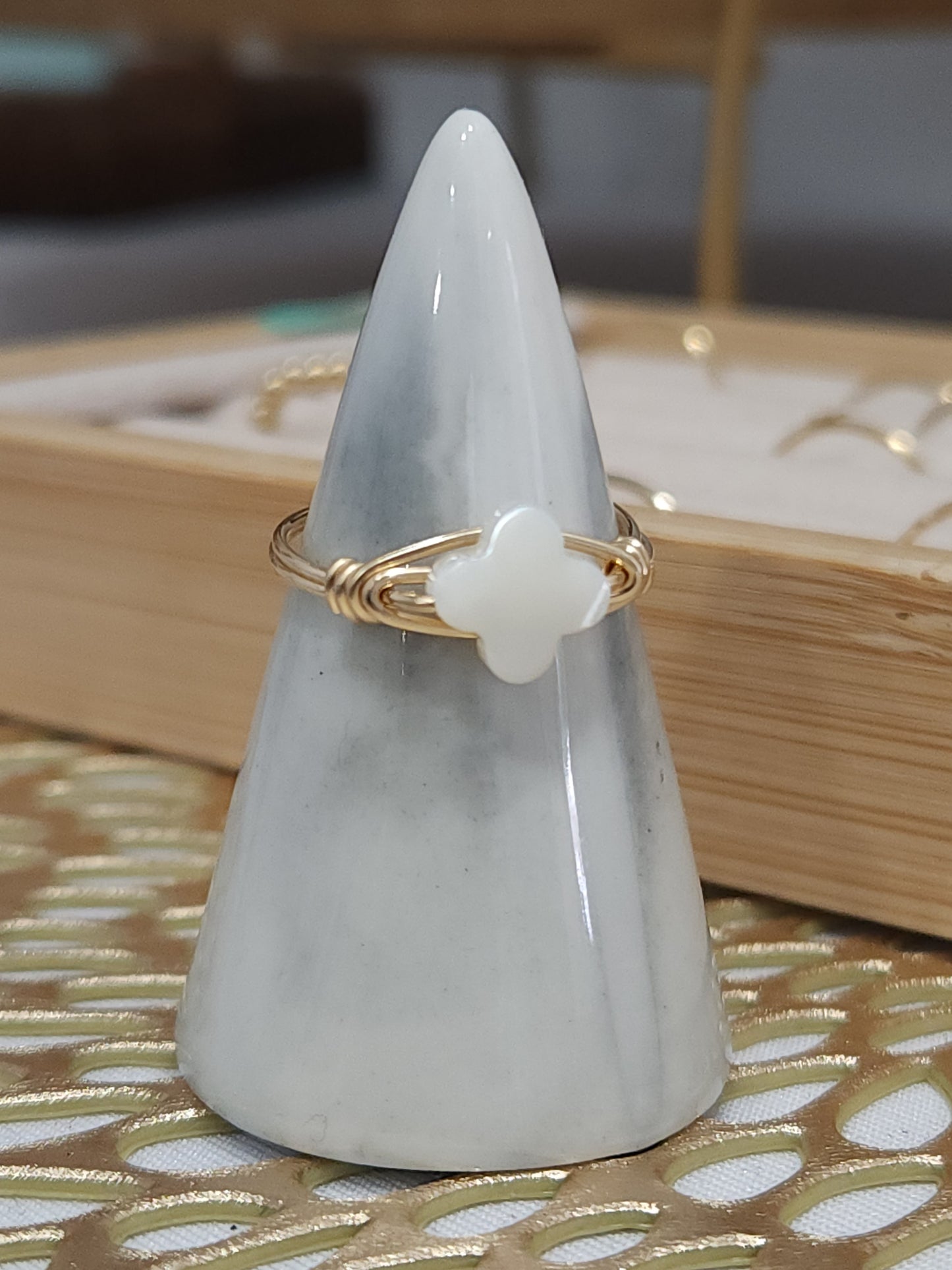 Side view of handcrafted clover ring wrapped in 14k gold-filled wire