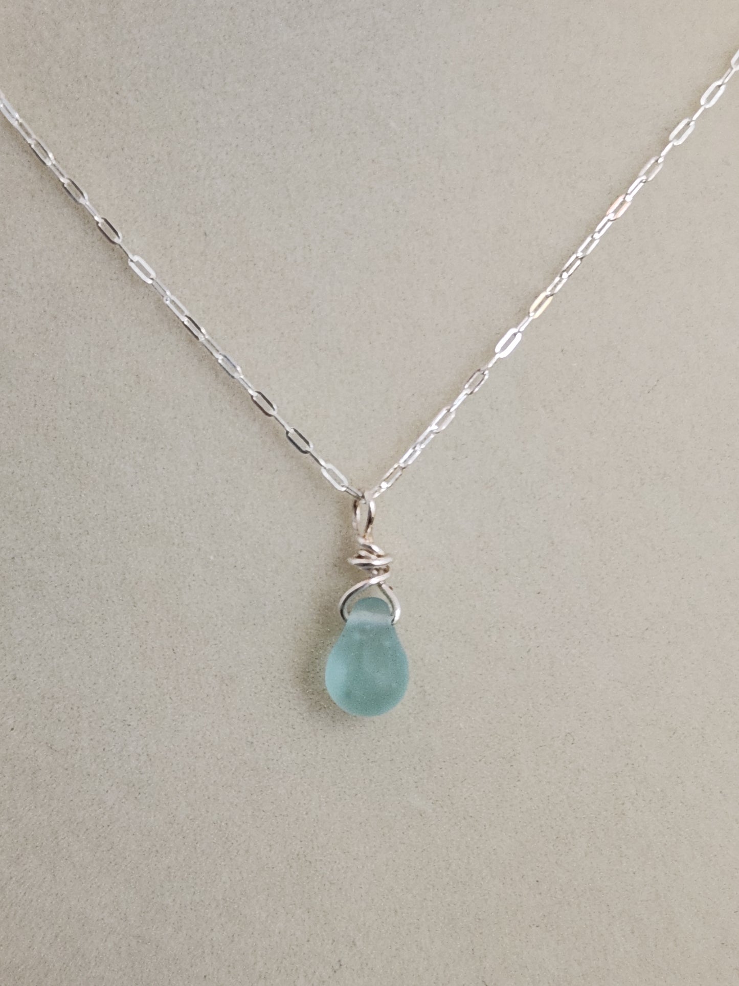 Dark blue sea glass pendant necklace handcrafted with sterling silver wire