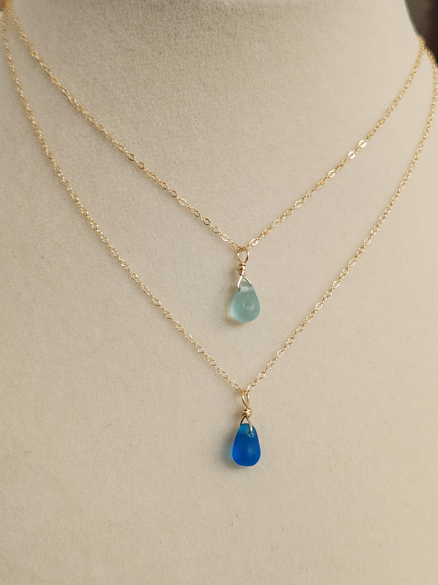 Destin sea glass necklace with 14k gold-filled chain featuring layered light and dark blue pendants