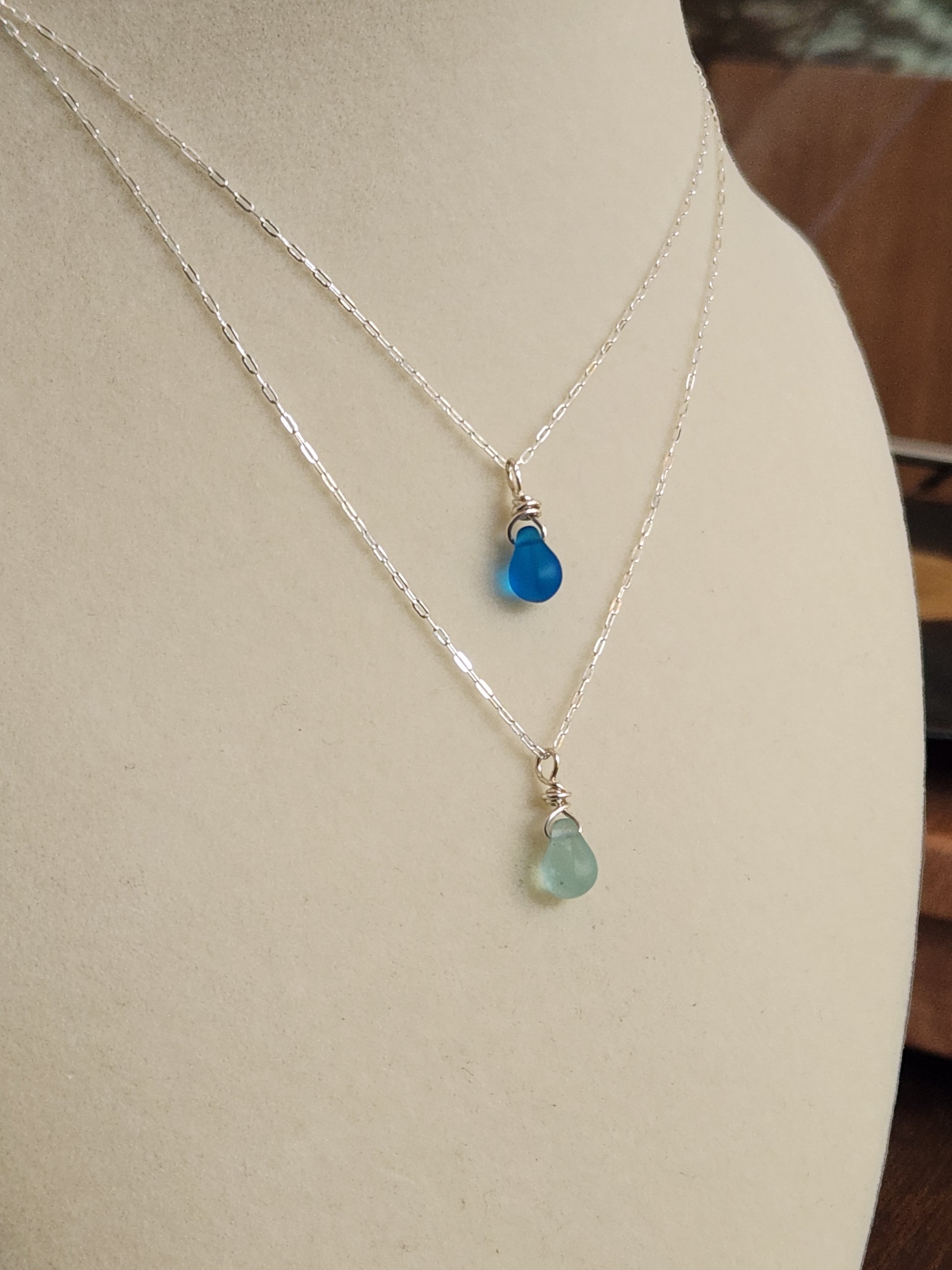 Handcrafted Destin sea glass necklace with sterling silver chain and frosted blue glass pendant