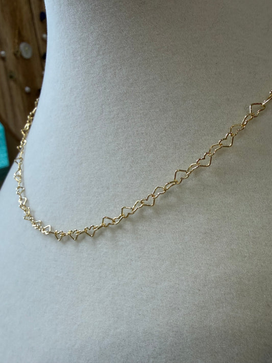 14k gold-filled heart necklace styled alone for a delicate, minimalist look