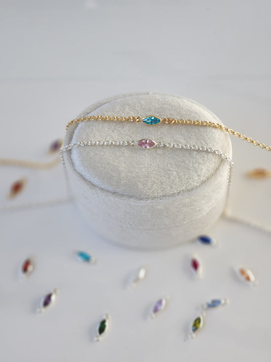 Marquise birthstone charm for permanent jewelry available in sterling silver and 14k gold filled, displayed with multiple gemstone color options