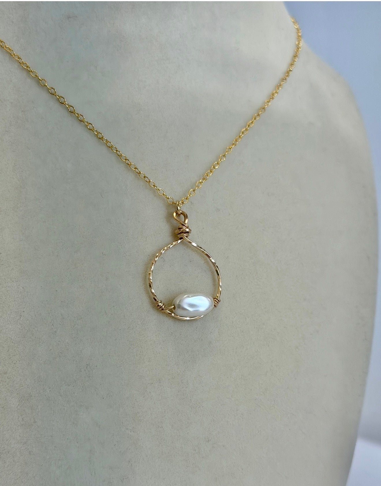 Side view of 14k gold-filled pearl necklace used in permanent jewelry services in Destin, FL