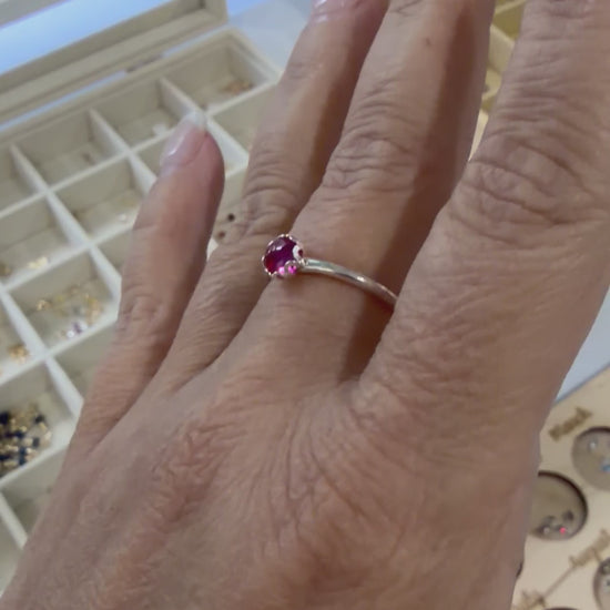 Video showing a sterling silver ruby ring worn on the hand, highlighting the vibrant red gemstone