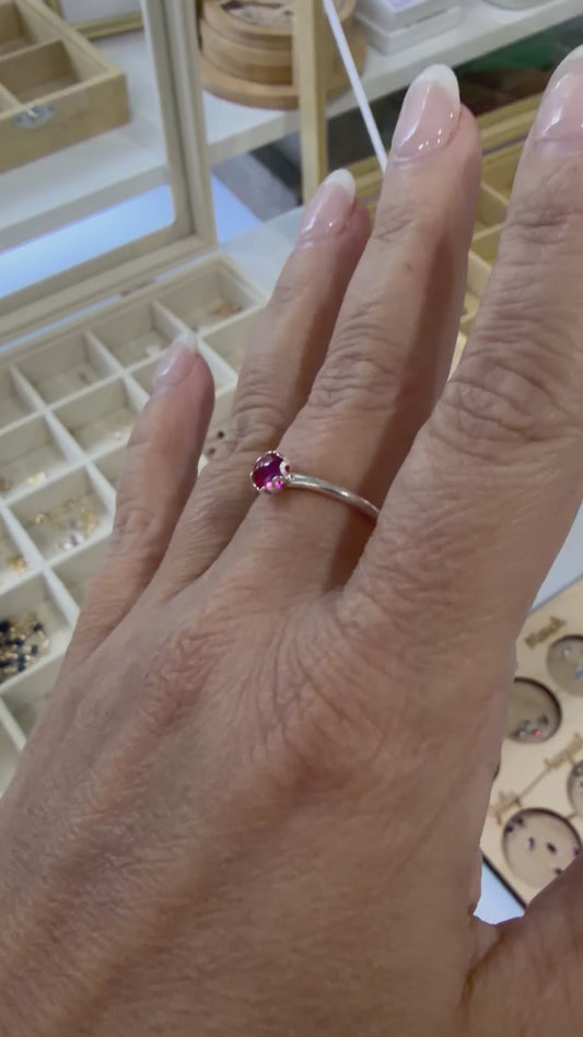 Video showing a sterling silver ruby ring worn on the hand, highlighting the vibrant red gemstone