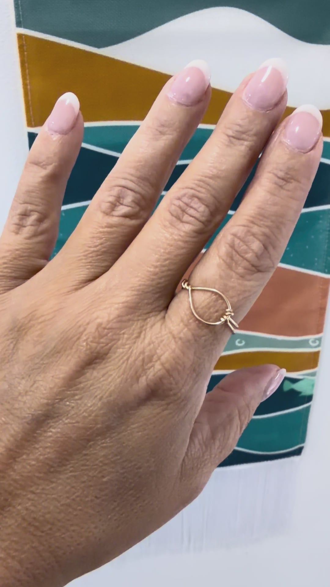 Video showing the Eye of the Sea ring worn on the hand, highlighting the open-loop gold-filled design