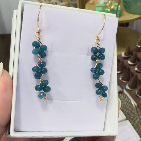 Short video showing blue apatite gemstone earrings made with 14k gold-filled wire, featured in a permanent jewelry collection in Destin, FL