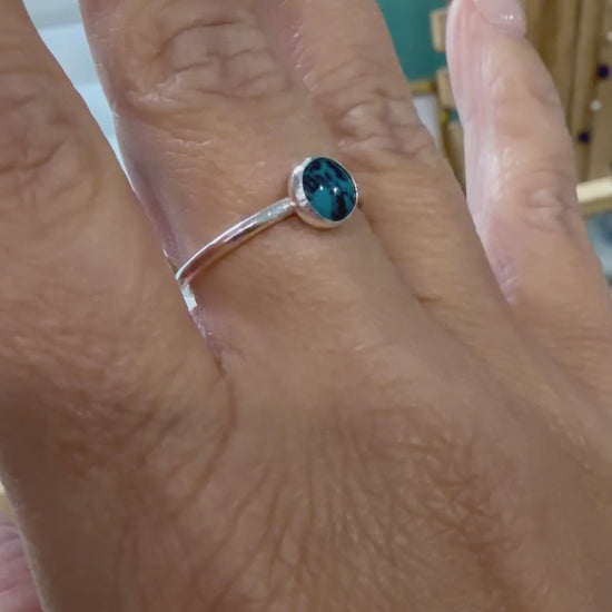 Video showing a sterling silver turquoise ring worn on the hand, handcrafted by Terra Handcrafted in Destin, Florida