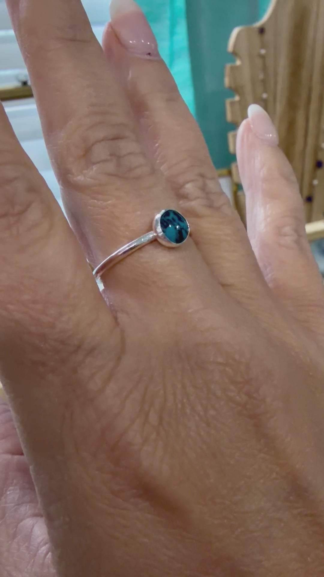 Video showing a sterling silver turquoise ring worn on the hand, handcrafted by Terra Handcrafted in Destin, Florida