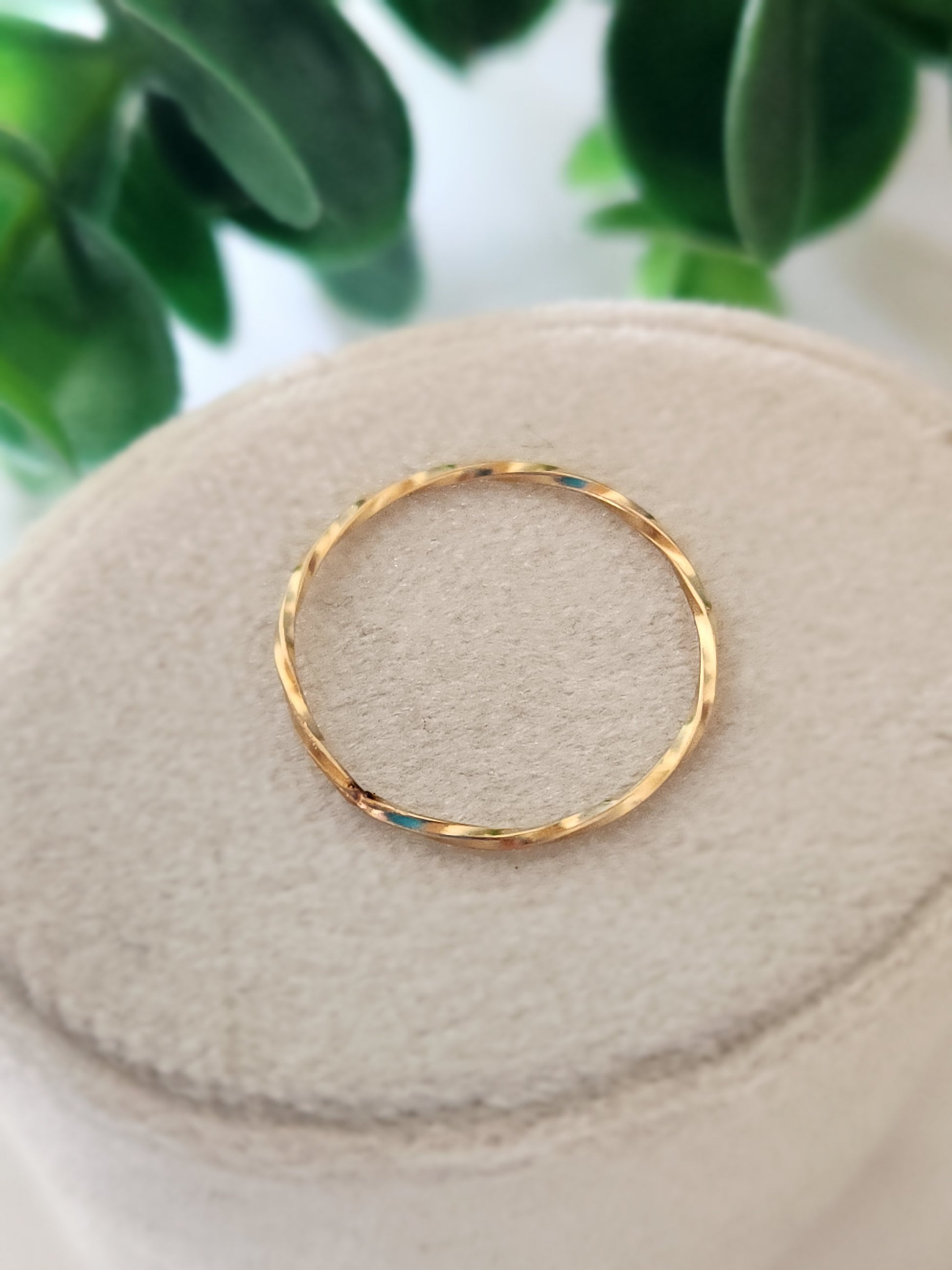 Single 14k gold-filled tide stacking ring with hammered wave-like texture