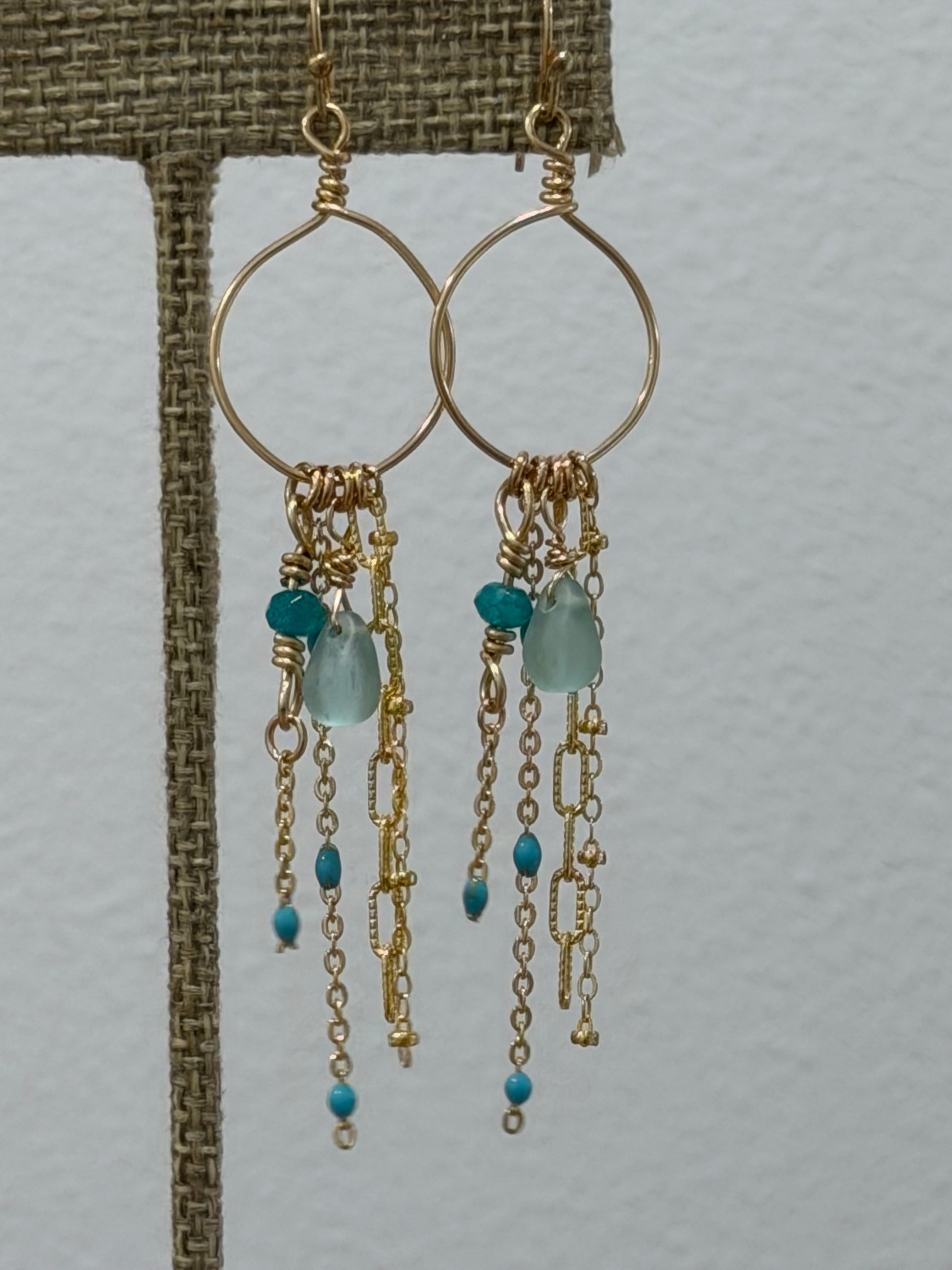 Whispering Waves earrings handcrafted with 14k gold-filled wire and aquamarine, apatite, and turquoise-hued beads
